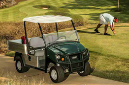 Turf utility vehicle for golf course operations and grounds maintenance