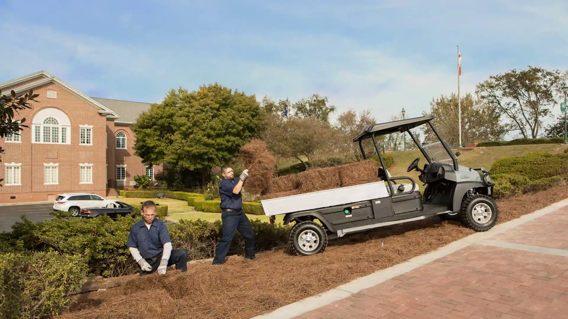 Carryall 1500 4x4 utility vehicle with groundskeeping crew