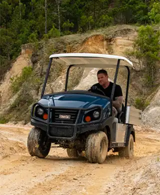 Utility vehicle with heavy duty suspension for rugged terrain
