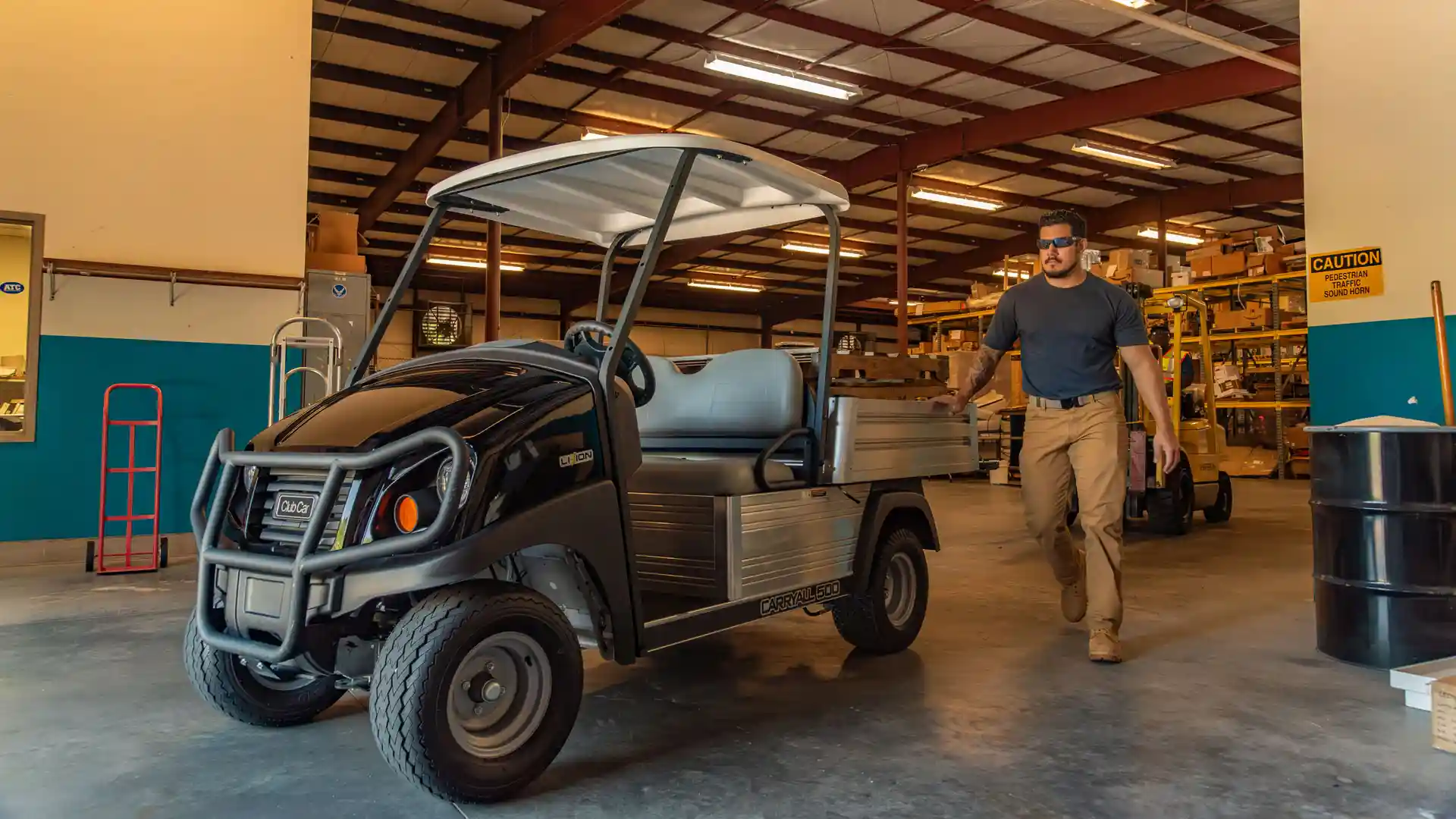 Carryall 500 gas or electric utility vehicle at warehouse