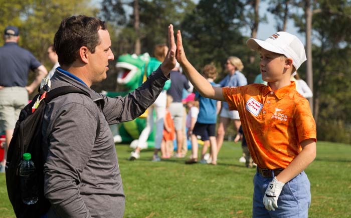kids golf high-five