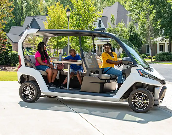 CRU electric vehicle in family driveway