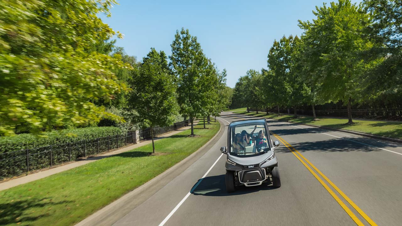 Club Car Cru Neighborhood Electric Vehicle is street-legal and can be driven on public roads posted 35mph or less