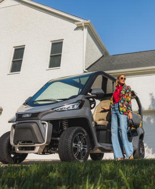 CRU street-legal neighborhood vehicle parked in driveway