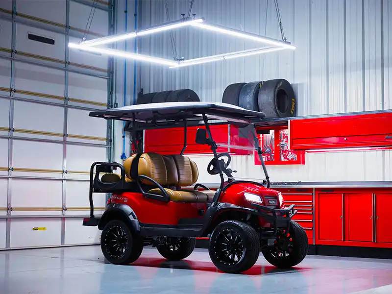 red lifted 4 passenger onward golf cart with custom wheels